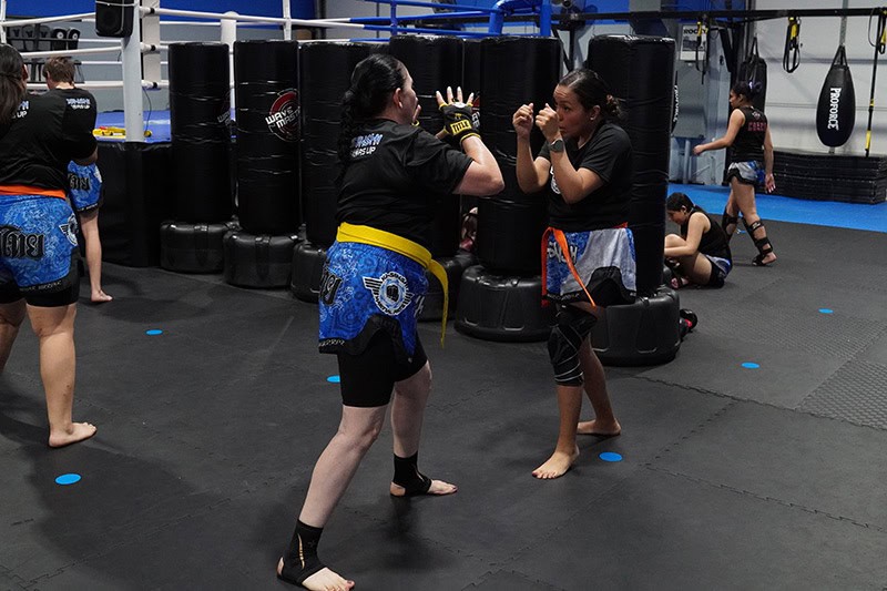 Adult students practice sparring drills during martial arts class at Ki-Senshi in Chandler, AZ.