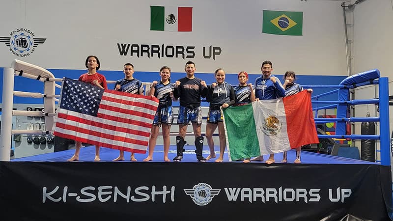 The Ki-Senshi team stands together in the ring representing discipline, unity, and martial arts excellence.
